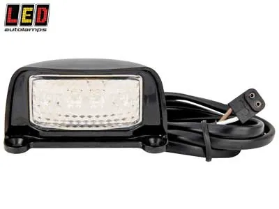 LED AUTOLAMPS LED Numura Zīmes Apgaismojums - Kompakts Melns Dizains, 12-24V, Shock-Proof