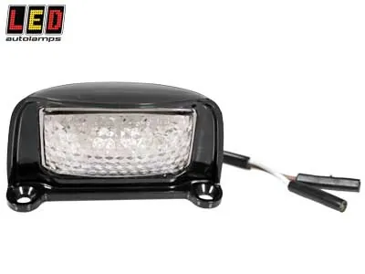 LED AUTOLAMPS Kompakts LED Numura Zīmes Apgaismojums 12-24V, Melns, Triecienizturīgs, ECE Sertificēts